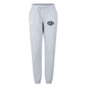The EMB Canterbury Woodlands Youth Wolfpack Women's Leisure Sweatpant features a light gray color, drawstring waist, elastic cuffs, and a green and black animal logo on the left thigh. Made from soft organic cotton for comfort.