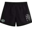 The Woodlands Youth Wolfpack Tactic Short by EMB Canterbury features a black design with an elastic waistband, white Canterbury logo on the right leg, and a green/white patch on the left—ideal for youth rugby or training.