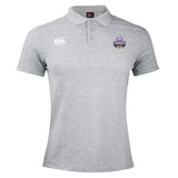 The Capitals Rugby NC Waimak Polo by EMB Canterbury is a light gray collared shirt with the CCC Waimak Rugby Polo logo on the right chest and a Capitals team logo on the left—ideal for rugby fans.
