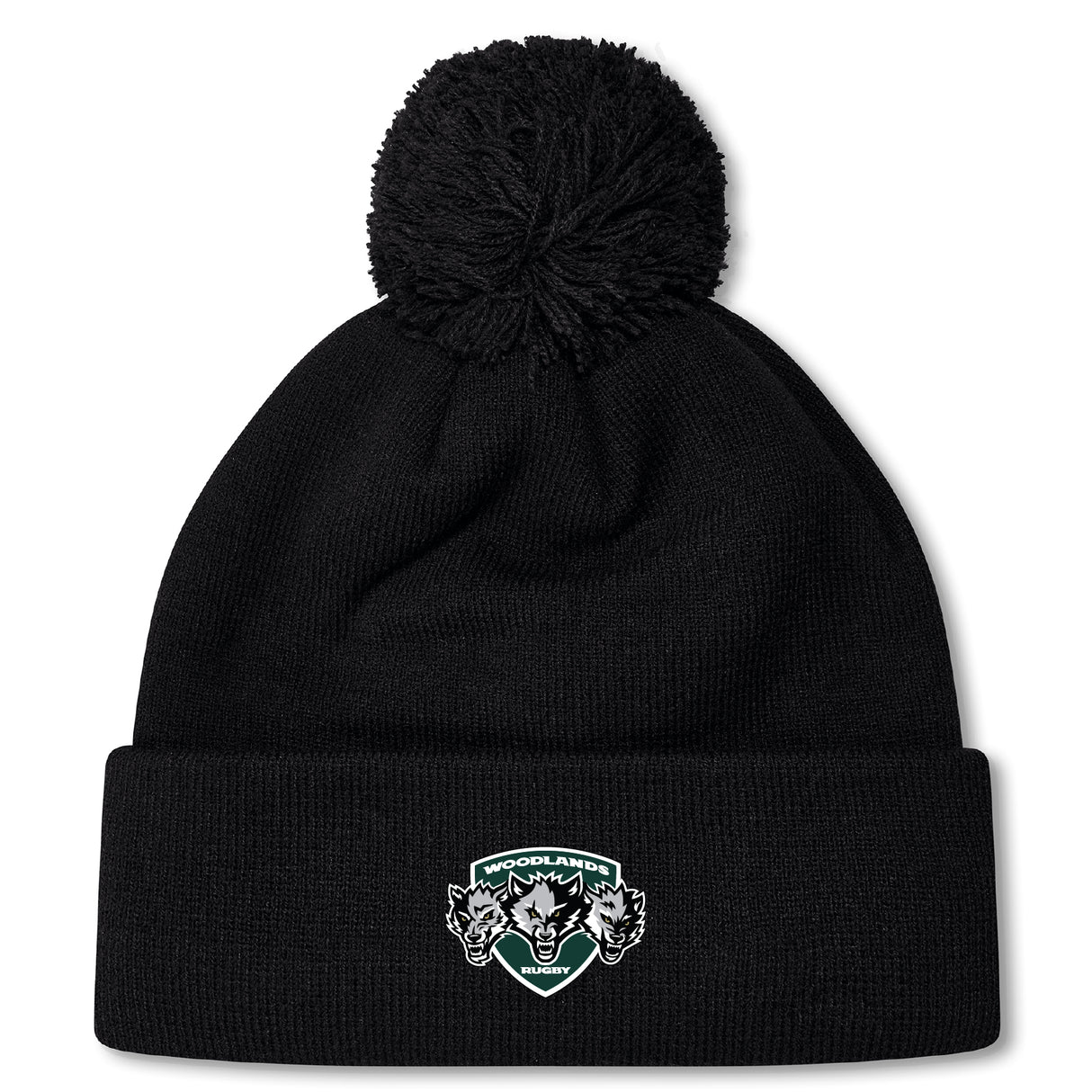 The Woodlands Youth Wolfpack Pom Pom Beanie by Canterbury from EMB Canterbury is a black knit, fleece-lined beanie with a large pom-pom and a "Woodlands Rugby" logo patch with three wolves on the folded brim.