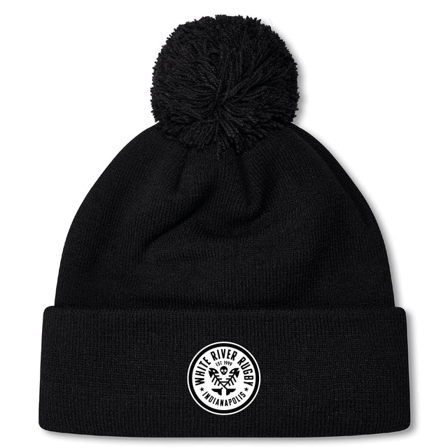 The White River Rugby Football Club Pom Pom Beanie by EMB Canterbury features a black knit design, a pom-pom top, and a round white front patch for classic style.