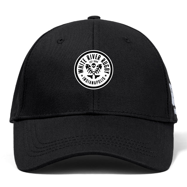 The White River Rugby Football Club Flexfit Drill Cap by EMB Canterbury features a circular "White River Rugby Indianapolis" embroidered logo in white and black on the front center panel.
