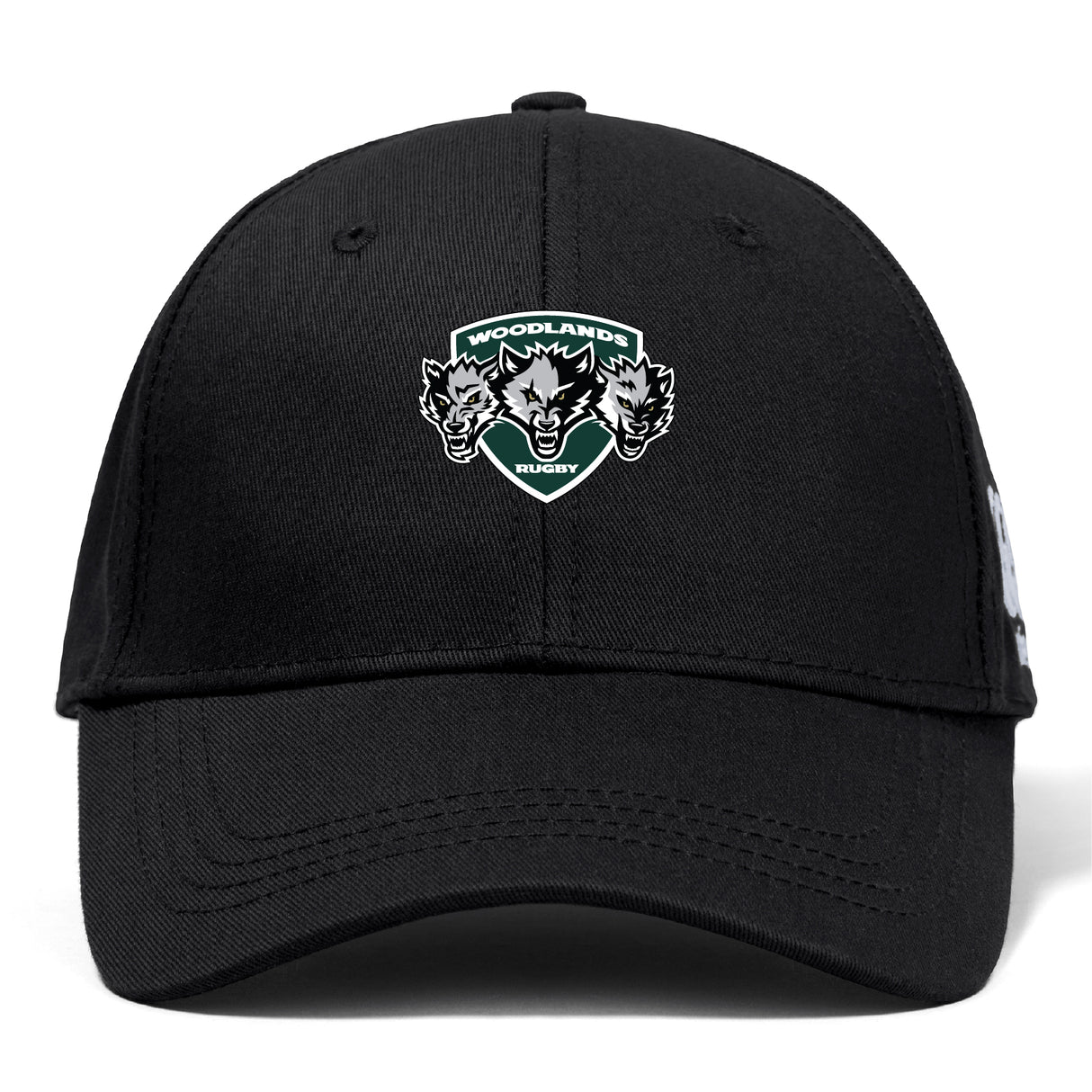 The Woodlands Youth Wolfpack Flexfit Drill Cap by Canterbury features an embroidered "Woodlands Rugby" logo with three wolf heads on the front. Brand: EMB Canterbury. Color: black.