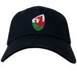 The Wales Shield Flex Drill Cap by EMB Canterbury boasts a striking red dragon emblem on its front.