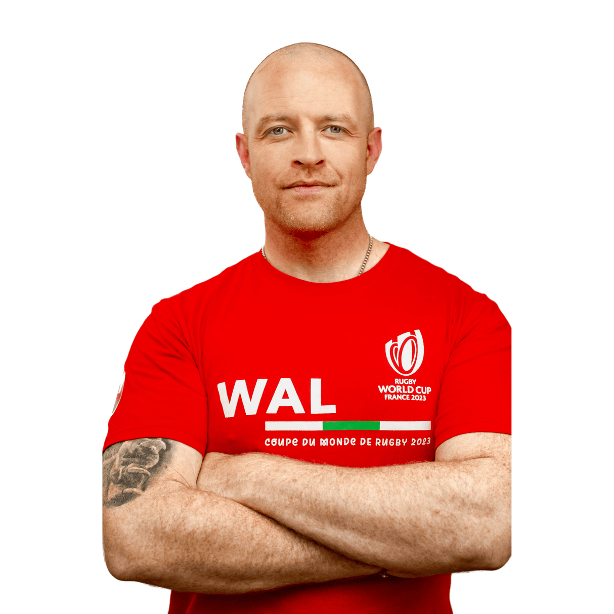 A man in a red Sportfolio Rugby World Cup 23 Wales Supporters T-Shirt with his arms crossed.