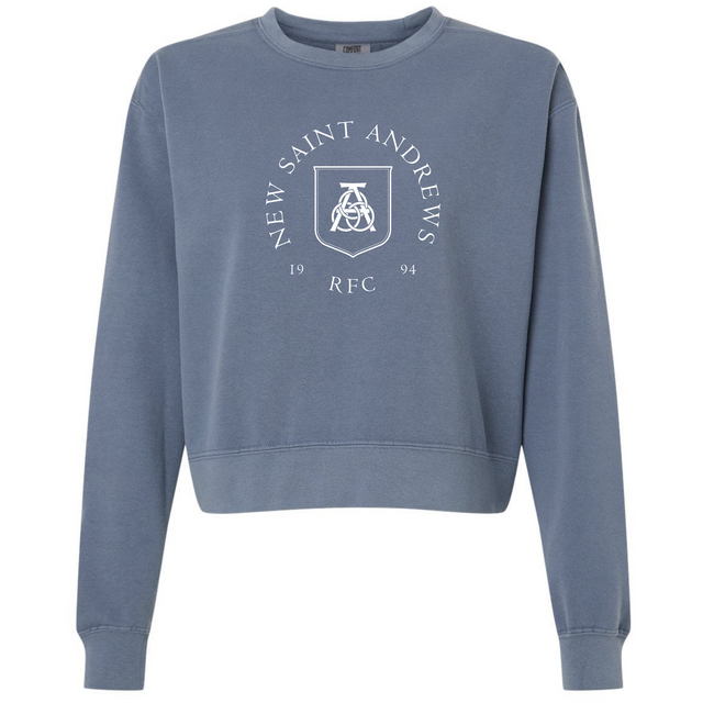 Introducing the New Saint Andrews College Women’s Garment-Dyed Mid-Length Crewneck Sweatshirt by EMB S&S Activewear—a blue heavyweight fleece sweatshirt designed with a mid-length silhouette. This stylish and comfortable everyday crewneck features “New Saint Andrews RFC 1994” and a white crest printed on the front.