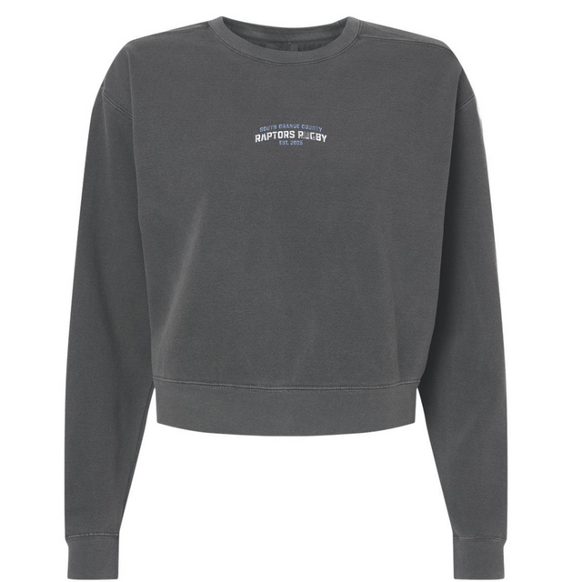 The EMB S&S Activewear South Orange County Raptors Women’s Garment-Dyed Mid-Length Crewneck Sweatshirt comes in a dark gray hue and features small white chest text stating, “Raptors Playby Est. 1995.” Made from heavyweight fleece, this relaxed-fit sweatshirt includes ribbed cuffs for enduring comfort and style.