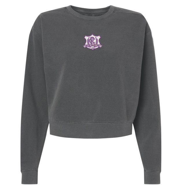 Charcoal gray garment-dyed Western Carolina University Women’s Garment-Dyed Mid-Length Crewneck Sweatshirt with a Western Carolina Rugby emblem on the chest.