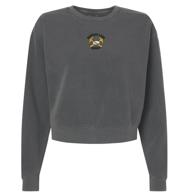 Charcoal gray heavyweight Mother Lode Women’s Garment-Dyed Mid-Length Crewneck Sweatshirt with a small “Mother Lode Rugby” emblem featuring crossed pickaxes and a rugby ball on the chest.