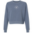 EMB S&S Activewear New Saint Andrews College women’s garment-dyed mid-length crewneck sweatshirt in blue heavyweight fleece, featuring long sleeves and a small white circular logo with “New Saint Andrews RFC ’94” printed on the chest.