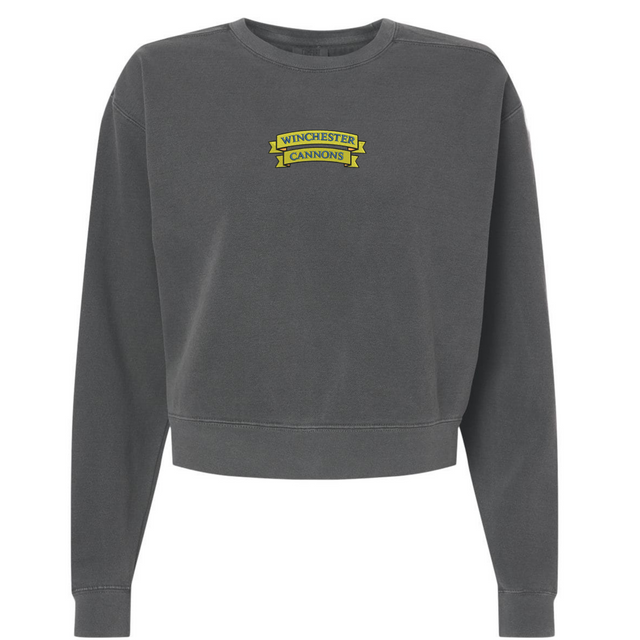 The EMB S&S Activewear Winchester Cannons Women’s Garment-Dyed Mid-Length Crewneck Sweatshirt is a dark gray, long-sleeved fleece crafted for cozy comfort, featuring a small yellow “Winchester Cannons” logo on the upper left chest.