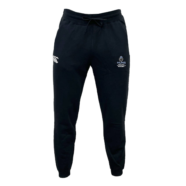 The Austin Huns Youth Rugby Leisure Sweatpant by EMB Canterbury features a black athletic design with a drawstring waist, made from recycled polyester sweatpants material and displaying white logos on both front thighs.