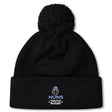 Stay warm in the Austin Huns Youth Rugby Pom Pom Beanie by EMB Canterbury, featuring a black knit design, fleece lining, and an embroidered "Huns Youth Rugby" Viking helmet logo on the front.