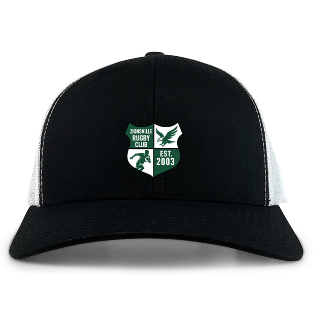 The Zionsville Rugby Club Retro Trucker Cap by EMB S&S Activewear is a black and white cap with a green and white embroidered "Est. 2003" design on the front and a classic snapback closure.
