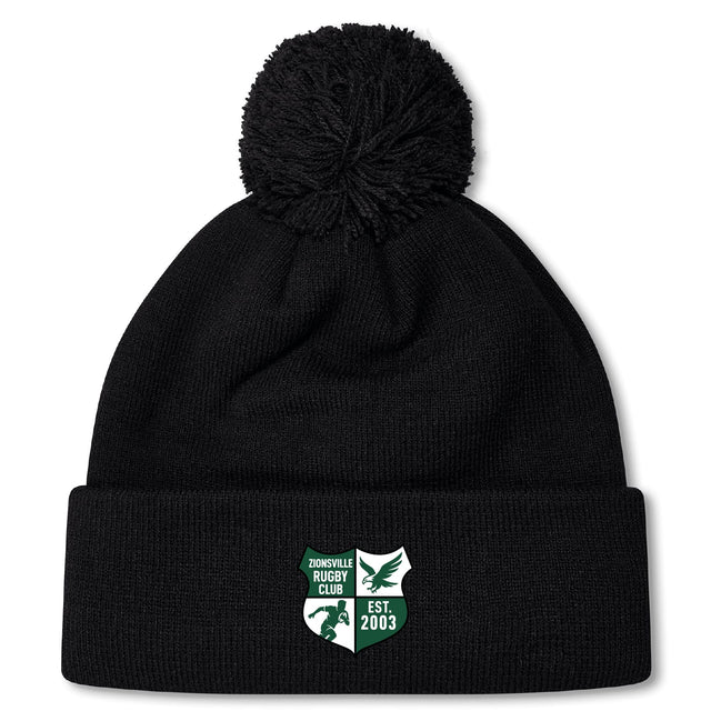 Stay warm in the Zionsville Rugby Club Pom Pom Beanie by Canterbury, featuring a fleece lining, stylish pom-pom, and club logo patch on the cuff. From EMB Canterbury—perfect for rugby fans!.