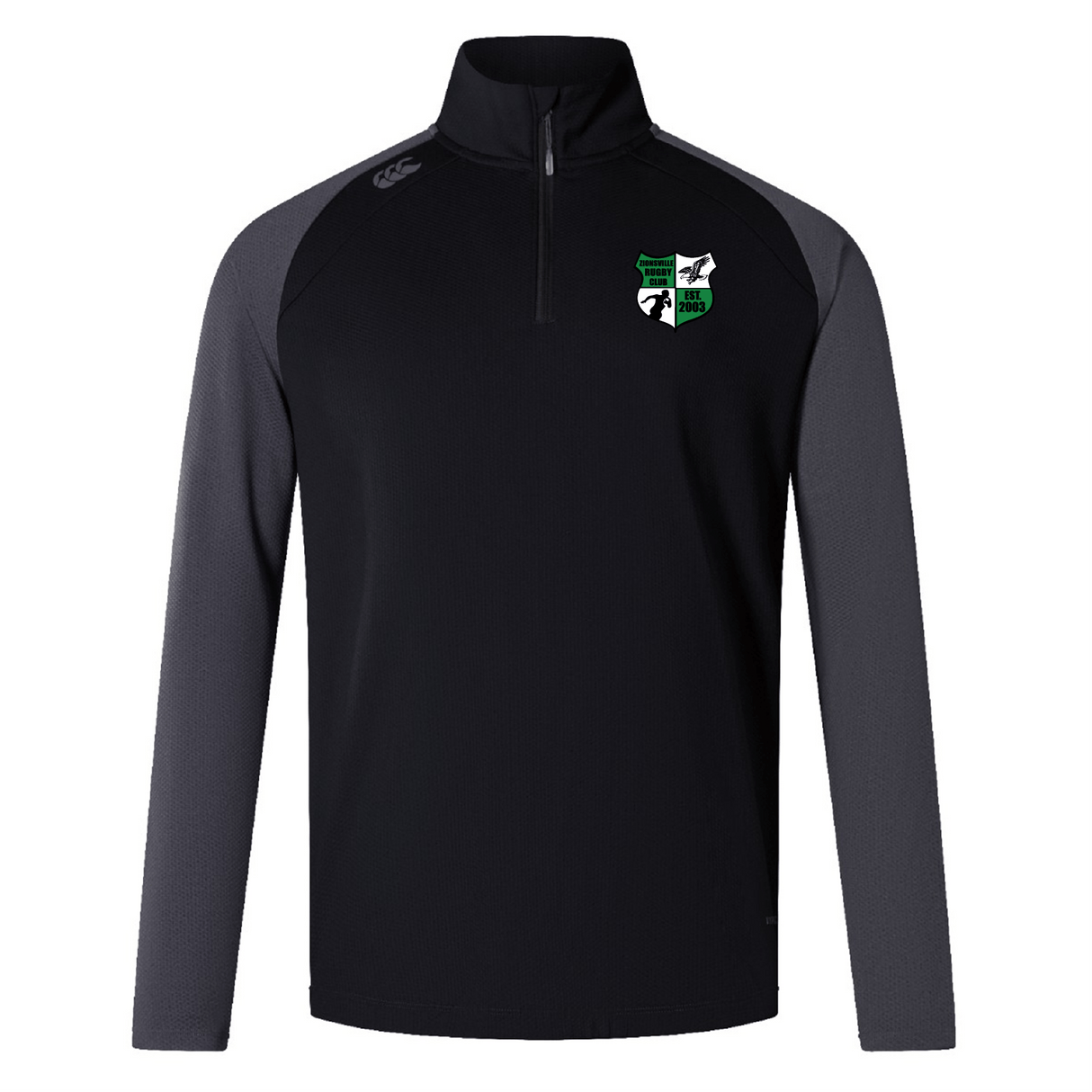 The Zionsville Rugby Women's Elite First Layer by Canterbury, from EMB Canterbury, is a black and dark gray long-sleeve pullover with a quarter zip. Made from honeycomb fabric with VapoDri technology, it features a crest logo on the left chest for added sophistication.