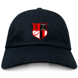 The Amoskeag Rugby Club Adult Low-Profile Cotton Twill Dad Cap by EMB S&S Activewear is black with a red and black shield emblem featuring sports symbols and "AMOSKEAG Est. 1984" embroidered on the front.