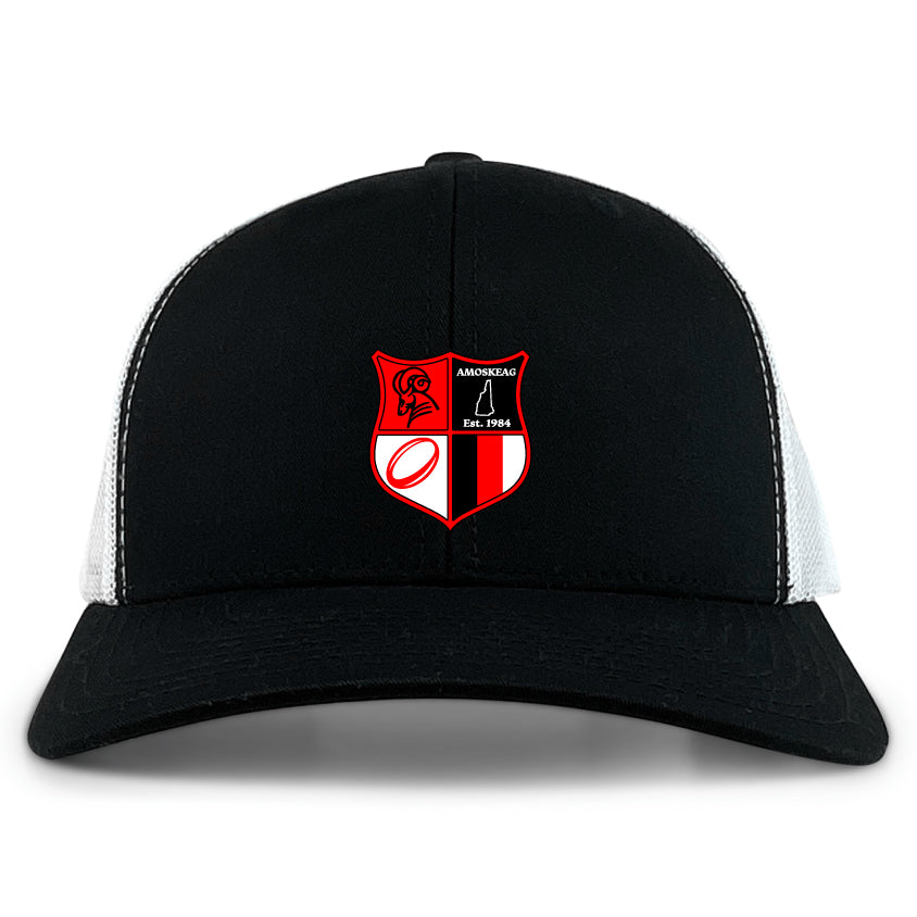 The Amoskeag Rugby Club Retro Trucker Cap by EMB S&S Activewear features a black and white design with a red and black crest—lion, rugby ball, sailboat, "Est. 1966"—on the front and an adjustable snapback closure for the perfect fit.