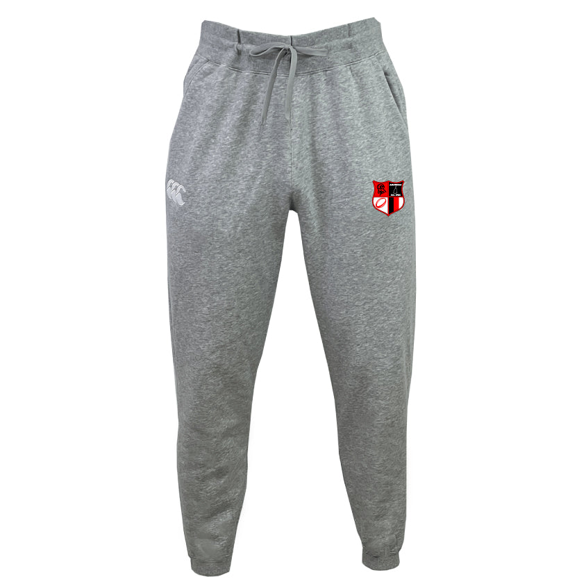 The Amoskeag Rugby Club Leisure Sweatpant by EMB Canterbury is made from recycled polyester fleece and features a white logo on the left pocket, a red, black, and white shield emblem on the right thigh, and a drawstring waist for adjustable comfort.