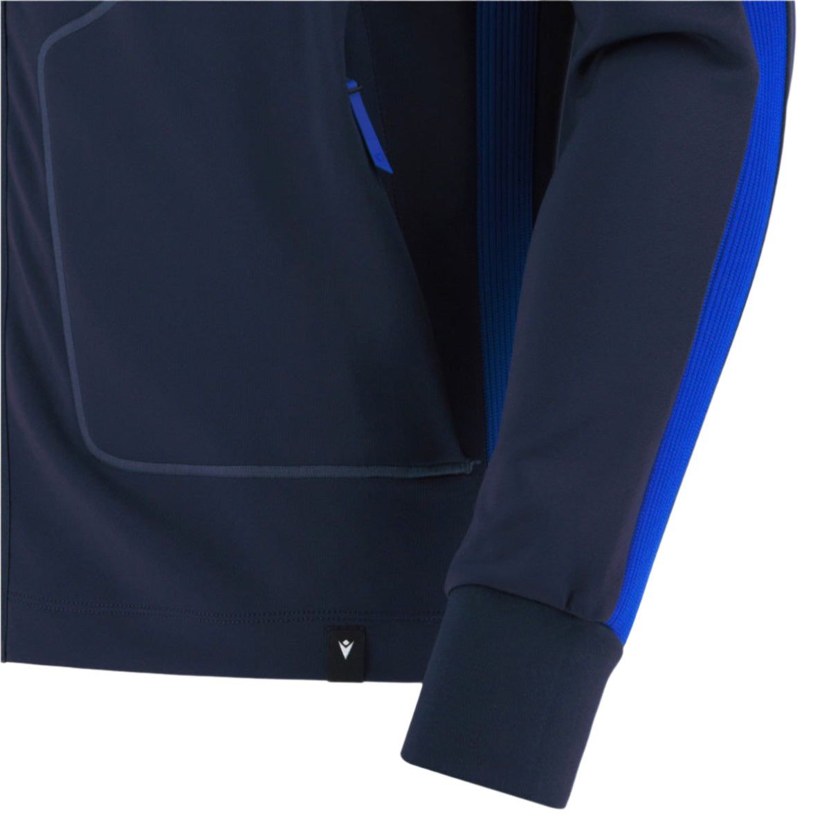 Close-up of the sleeve and side of the Italy 25/26 Anthem Jacket by Macron, featuring a blue stripe along the arm and a small black logo tag near the bottom hem.