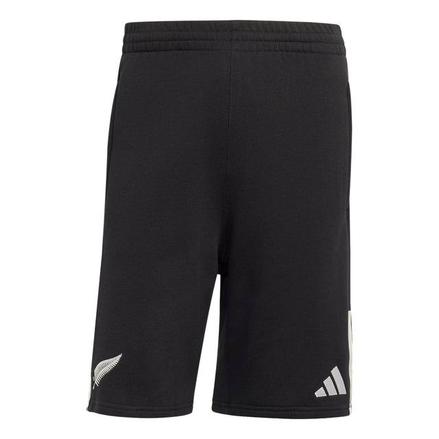 The All Blacks 26/27 Leisurewear Shorts by adidas feature an elastic waistband and are designed in black, with a distinctive white fern logo on the left leg and the adidas logo on the right leg, as seen from the back. These shorts are perfect for supporters looking for authentic adidas All Blacks leisurewear.