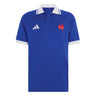 Show your support for the French Rugby Federation with the France FFR 26/27 Travel Polo by adidas—a blue, short-sleeve polo featuring a crisp white collar and cuffs, an embroidered white adidas logo on the right chest, and a bold red rooster emblem on the left chest. This official design is perfect for fans seeking classic rugby-inspired style from adidas.