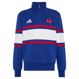 The France FFR 26/27 Travel 1/4 Zip Sweatshirt by adidas features a blue design with white and red horizontal stripes, accented by the iconic adidas logo and a red rooster emblem on the chest—a classic sweatshirt inspired by France Rugby style.