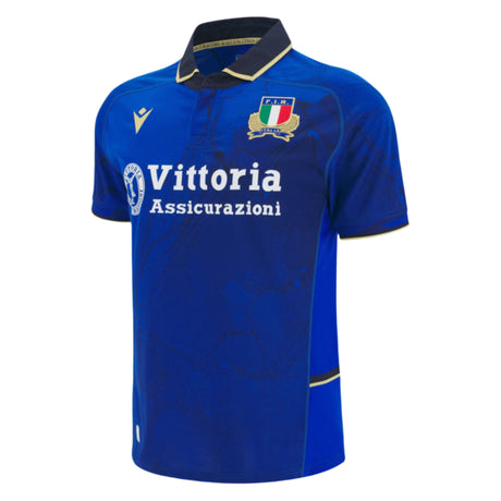 The Italy 25/26 Replica Home Jersey by Macron features short sleeves, a black collar, the national team crest, and sponsor logo—an essential blue rugby shirt for any Italy fan.