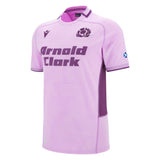 The Scotland 25/26 Replica Away Jersey by Macron features light purple fabric, dark purple side panels, the "Arnold Clark" sponsor logo, Scottish Rugby crest, and a Scotland flag on the sleeve—a must-have for fans.