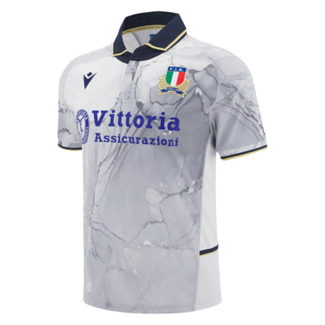 The Italy 25/26 Replica Away Jersey by Macron features a white and gray marble pattern, black collar, Italian crest, Vittoria Assicurazioni sponsor, and is inspired by the Italia Rugby Away Shirt design.