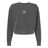 The EMB S&S Activewear Women's Birmingham Steel Mid-Length Crewneck Sweatshirt is garment-dyed in dark gray for a soft finish, with a small embroidered chest logo, shown on a white background.