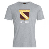 The Conestoga Rugby Club Plain Tee by WRS Canterbury is a grey shirt with a yellow and brown shield logo, "Conestoga Rugby Club," "EST. 1971" in white, and made from a soft cotton blend for comfort and style.