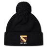 The Conestoga Rugby Pom Pom Beanie by EMB Canterbury is a black knit hat with a pom-pom, fleece lining, and features a gold and white "Conestoga Rugby Club" logo with "EST. 1971" on the front cuff.