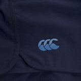Close-up of a dark blue Canterbury Elite Woven gym short with a triple crescent moon logo in light blue on the lower right corner.