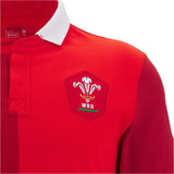 The Wales 25/26 Replica Home Cotton Jersey by Macron features a classic white collar and WRU logo—a timeless fan shirt perfect for any supporter.