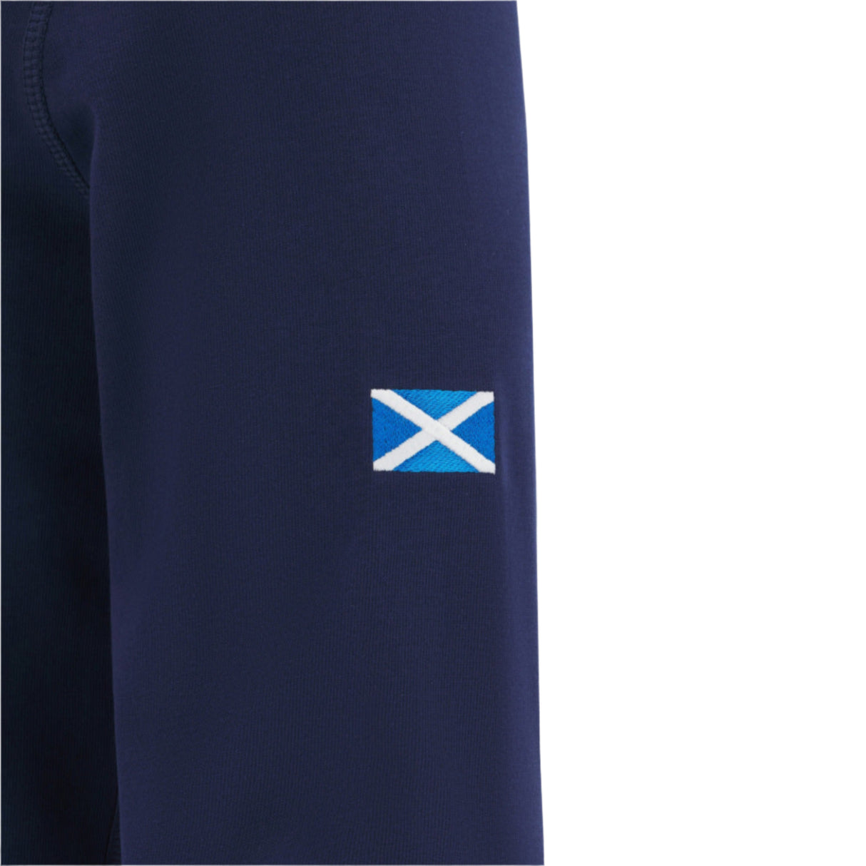 A small Scottish flag patch is sewn onto the sleeve of the navy Scotland SRU 25/26 Replica Home Long Sleeve Cotton Jersey by Macron, combining classic style and team pride.