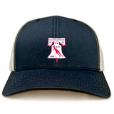 The Philly Whitemarsh RFC Retro Trucker Cap by EMB S&S Activewear features navy blue and beige panels, an embroidered club logo with a red rugby ball, "Philadelphia-Whitemarsh R.F.C. 1985" text, and an adjustable snapback closure.