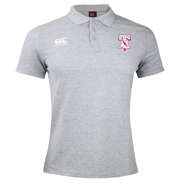 The Philly Whitemarsh RFC Waimak Polo by EMB Canterbury is a light grey short-sleeved rugby polo with a collar, three buttons, and embroidered logos on both sides of the chest.