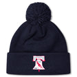 The Philly Whitemarsh RFC Pom Pom Beanie by EMB Canterbury features a navy knit design, fleece lining, pom-pom top, and a front patch with bell, bird, "R.F.C.," and years 1967 & 1985—perfect for chilly days.