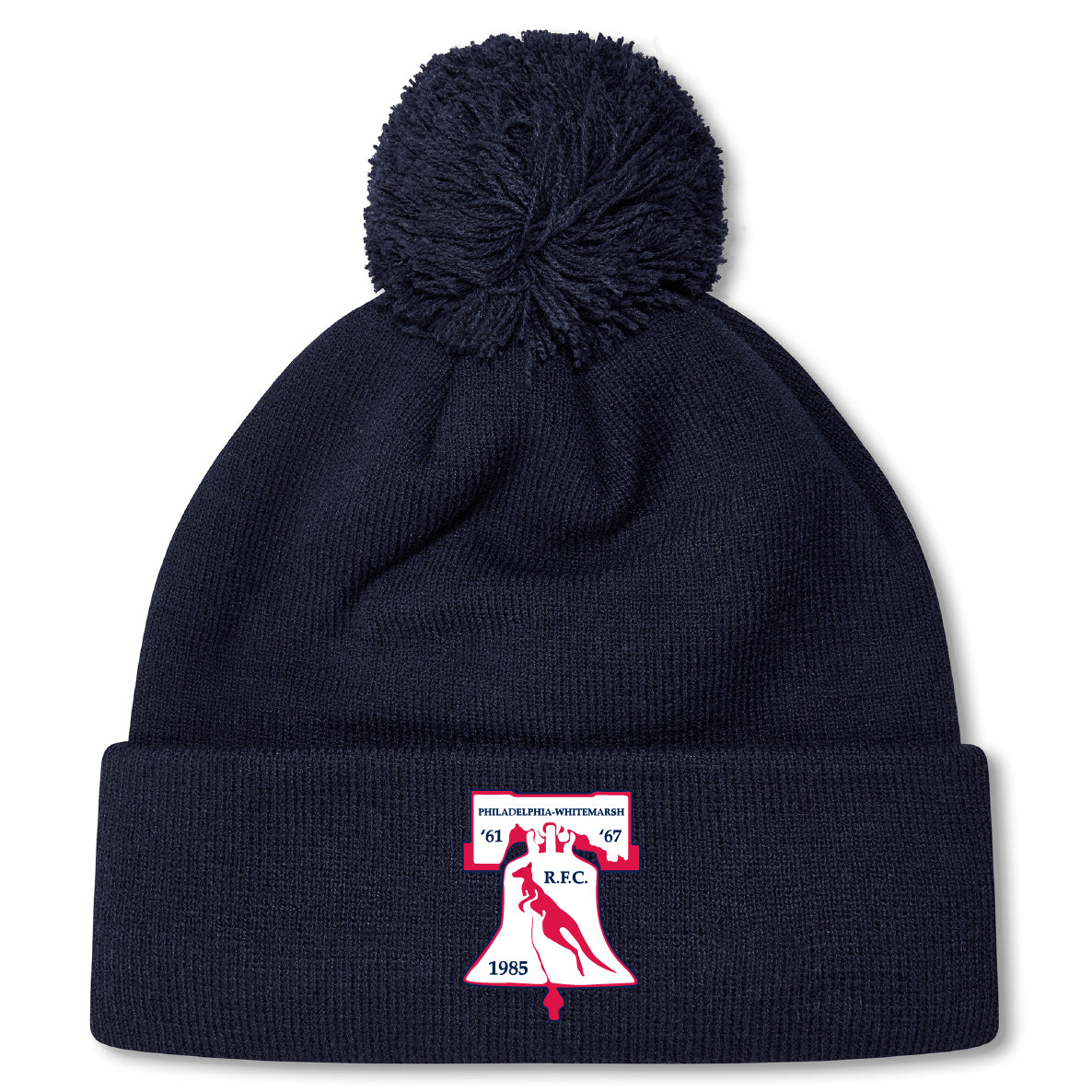 The Philly Whitemarsh RFC Pom Pom Beanie by EMB Canterbury features a navy knit design, fleece lining, pom-pom top, and a front patch with bell, bird, "R.F.C.," and years 1967 & 1985—perfect for chilly days.