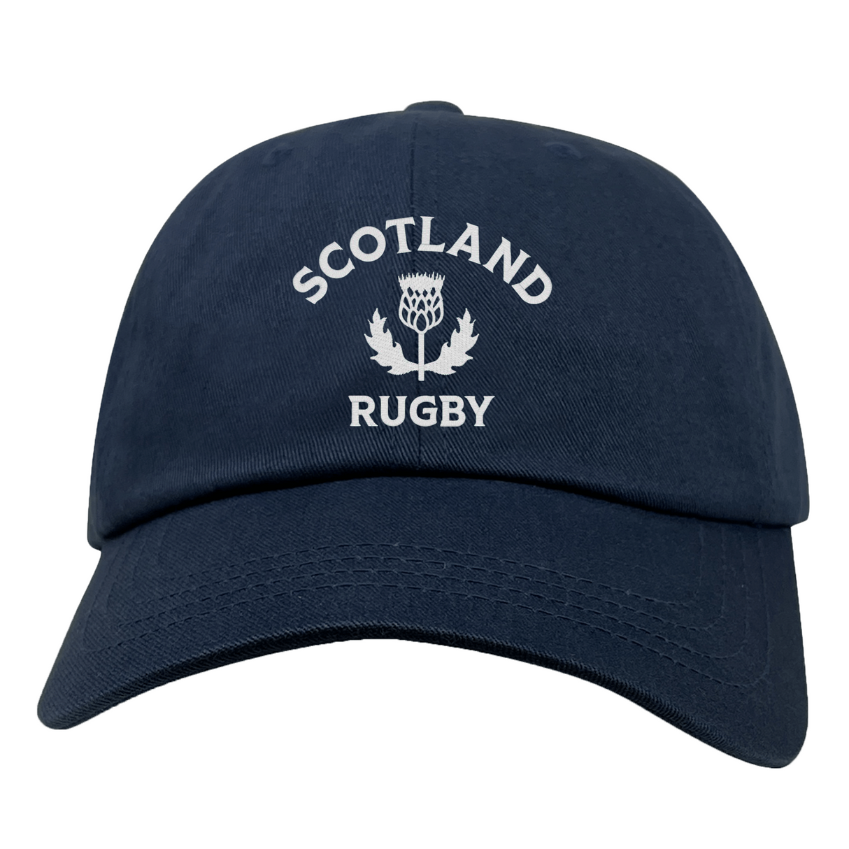 The EMB S&S Activewear Nations of Rugby Scotland Dad Cap features navy blue cotton twill and front white "SCOTLAND RUGBY" with thistle embroidery—a classic hat for rugby fans.