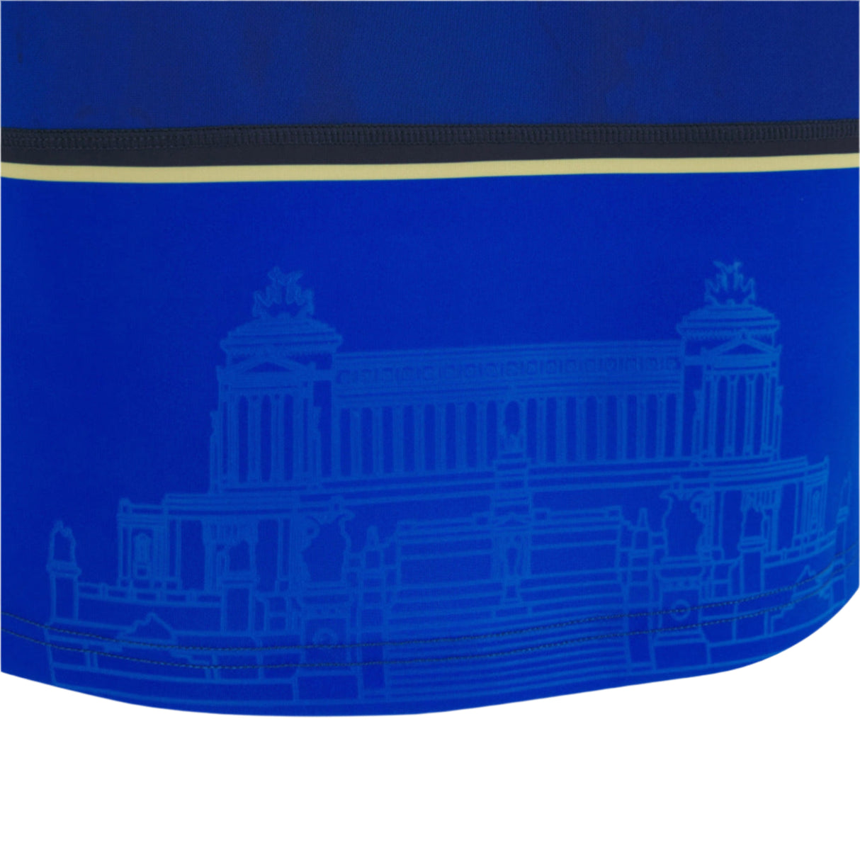 A close-up of the Italy 25/26 Replica Home Jersey by Macron shows blue fabric with a faint architectural line drawing and black and yellow horizontal stripes.