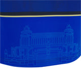 A close-up of the Italy 25/26 Replica Home Jersey by Macron shows blue fabric with a faint architectural line drawing and black and yellow horizontal stripes.