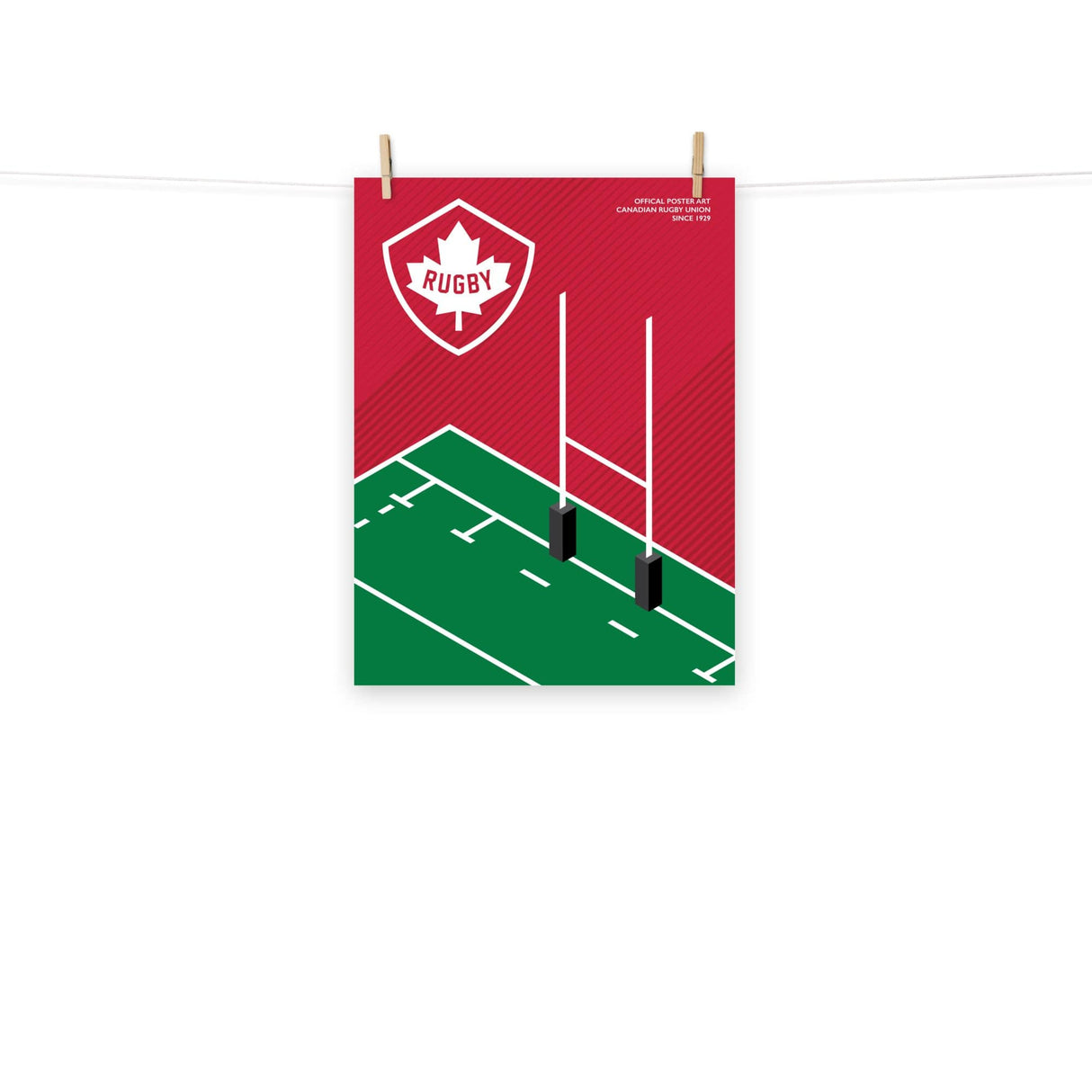 A PF LIC Rugby Canada Rugby Pitch Poster hanging on a clothesline.