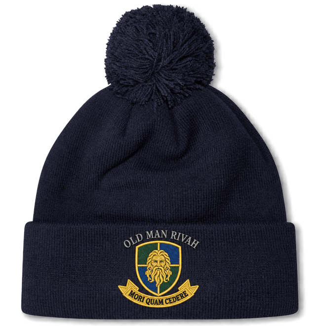Navy blue Old Man Rivah Rugby Pom Pom Beanie by Canterbury featuring a bobble and an embroidered cuff crest with a bearded face, the text “Old Man Rivah,” and a banner reading “Mori Quam Cedere.”.