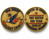 Two gold-toned USA Rugby Flight Crew 2026-27 Supporter’s Kit challenge coins: one side features an eagle emblem, and the other reads “United in Rugby One Nation One Team 2026-27 Inaugural Member.”