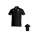 Teamatical New Saint Andrews College Malta Canterbury Kirra Performance Polo in black, featuring white accents, an embroidered logo on the left chest, and white embroidered symbols on the right chest and left sleeve. Back view displayed in the corner.