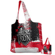 The Teamatical Birmingham Iron Women's Football DNA Packable Zip Tote features a red, black, and white abstract design with a "Birmingham Iron" logo. Durable and lightweight, it's ideal for daily use or travel.