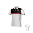 The Teamatical Archbishop Spalding Canterbury Legacy Performance Polo features a white short-sleeve design with a black upper section, a red stripe, red chest logos, and a plain white back.