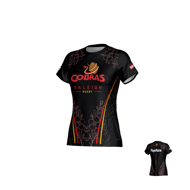 The Raleigh Cobras Canterbury Eco-Sublimate Tee - Womens by Teamatical is an eco-conscious rugby jersey crafted from sustainable materials, showcasing a striking red and gold logo, floral side patterns, sponsor logos, and “PlayerName” on the back—a perfect sublimated tee for dedicated fans.